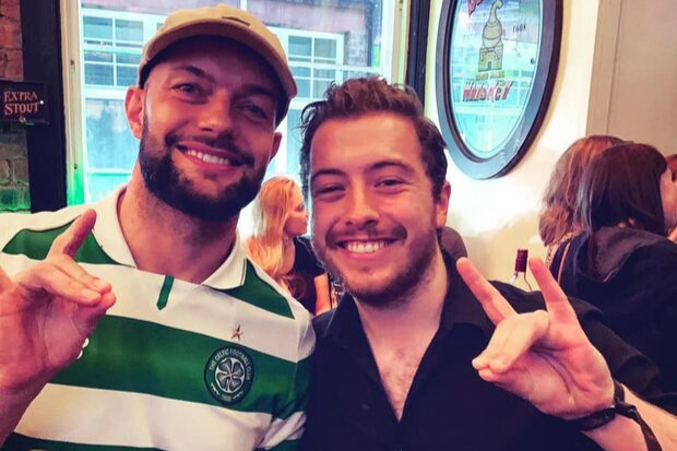 Celtic-daft WWE star Finn Balor poses with fans in Glasgow bar