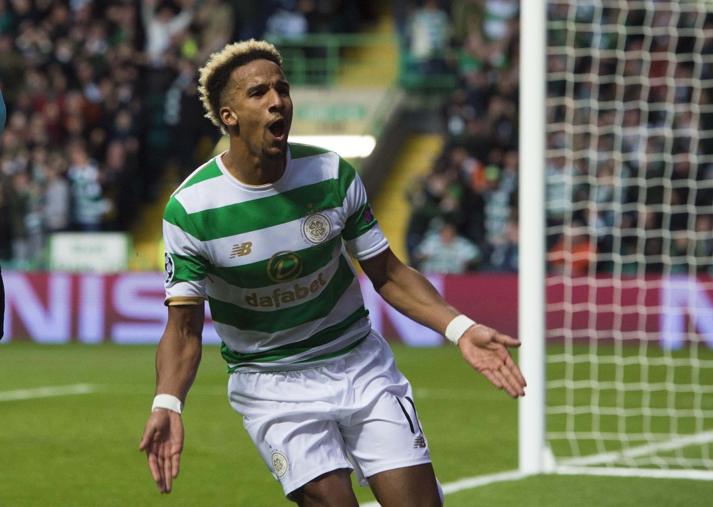 In pictures: Celtic star Scott Sinclair jets off to the sun...with his parents